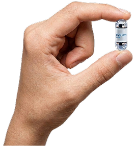 Close-up of a hand holding a small glass vial with clear liquid against a black background.